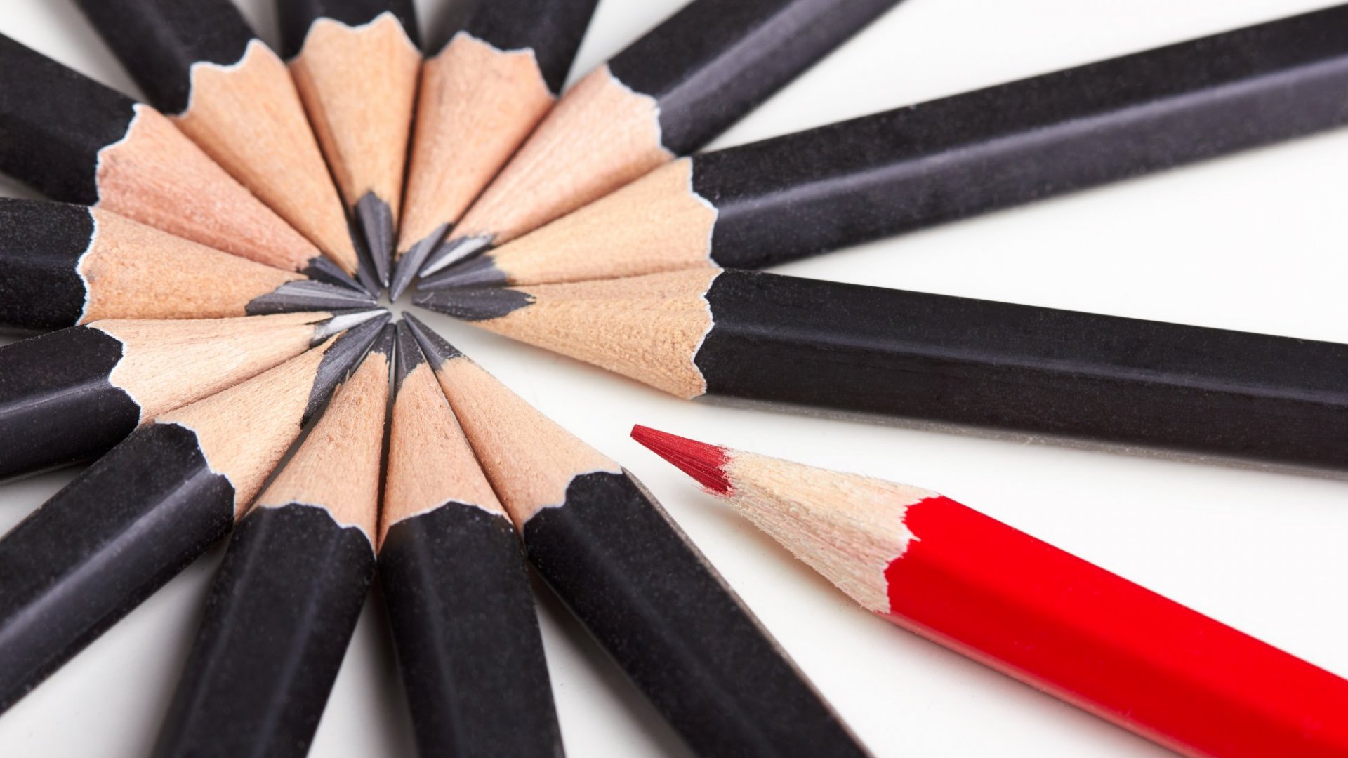 North Lincolnshire Council achieves outstanding from Ofsted. Image shows a circle of black pencils and one red pencil