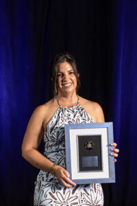 Sarah Codrington holding her award