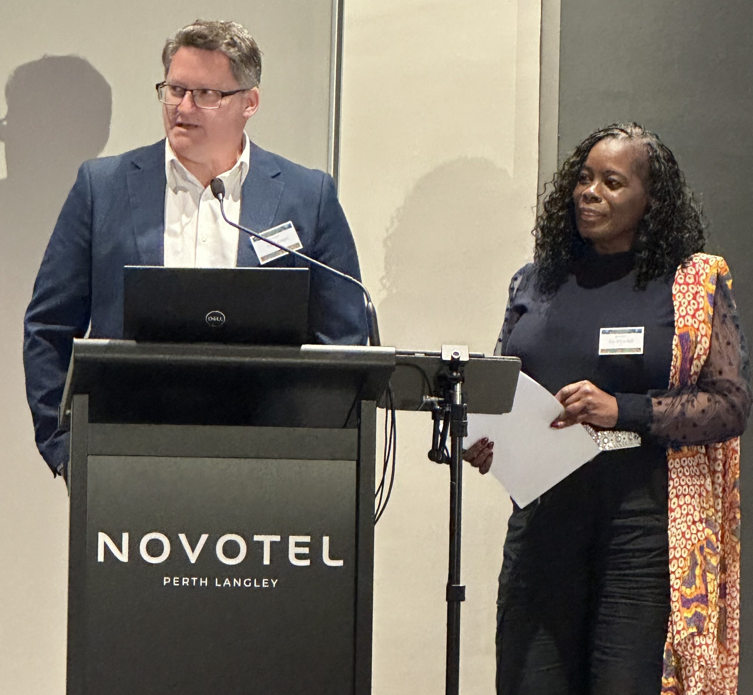 Adrian Gimpel on stage to give a brief background of himself and Elia